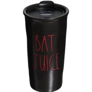 Rae Dunn black ceramic “Bat Juice” mug. New in box, only out to take picture.